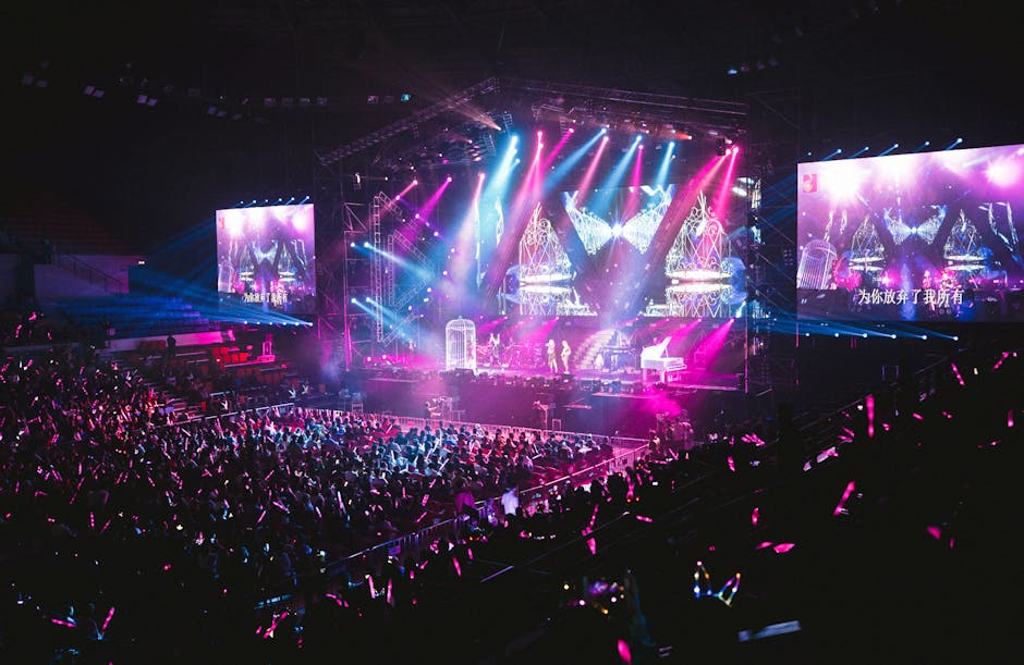 Colorful live concert with vibrant lighting, energetic crowd, and dynamic stage performance