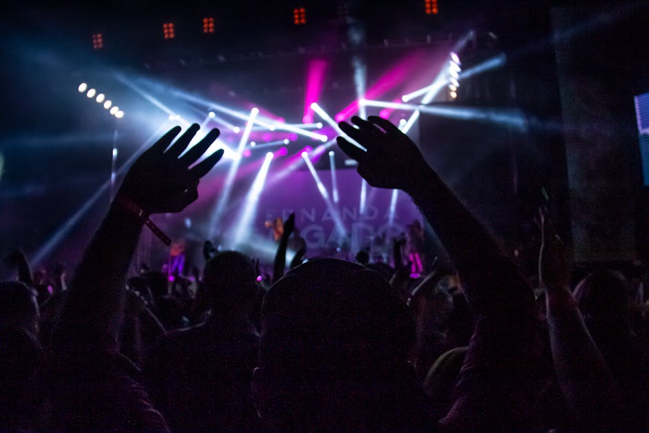 A vibrant night concert scene with a lively crowd enjoying the show in São Paulo, Brazil